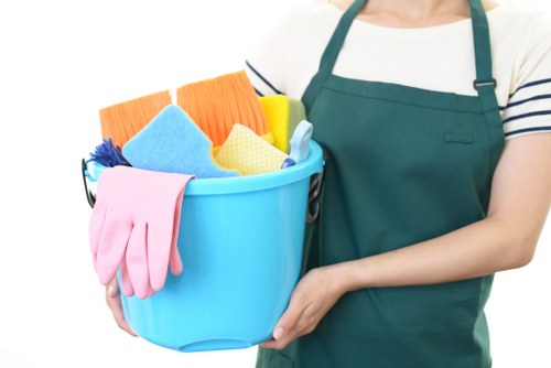 Commercial cleaning staff disinfecting shared office surfaces in N6