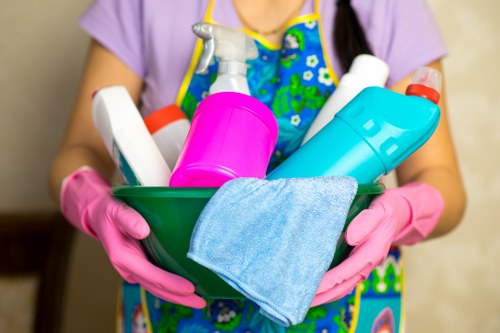 Office cleaning team sanitizing desks and meeting areas in N6