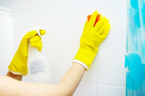Carpet cleaning technician working safely in a home with professional equipment
